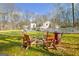 Outdoor firepit with chairs, set against a spacious backyard, perfect for gatherings at 106 Robinson Bend Trl, Peachtree City, GA 30269