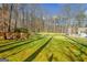 Backyard firepit area with Adirondack chairs offers a cozy outdoor gathering space at 106 Robinson Bend Trl, Peachtree City, GA 30269
