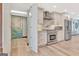 View of the kitchen, showcasing stainless steel appliances and white cabinetry, with access to another room at 106 Robinson Bend Trl, Peachtree City, GA 30269