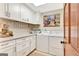 Well-lit laundry room featuring new appliances and white cabinetry at 106 Robinson Bend Trl, Peachtree City, GA 30269