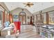 Living room features a vaulted ceiling, lots of windows, and beautiful wood floors and trim at 106 Robinson Bend Trl, Peachtree City, GA 30269