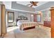 Spacious main bedroom with wood floors, tray ceiling, recessed lights, and lots of natural light at 106 Robinson Bend Trl, Peachtree City, GA 30269