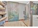 Walk-in pantry featuring storage shelves and modern appliances with an artistic painting at 106 Robinson Bend Trl, Peachtree City, GA 30269