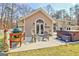 Outdoor patio space with grill, hot tub and cozy seating area, perfect for entertaining at 106 Robinson Bend Trl, Peachtree City, GA 30269
