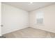 Bedroom with plush carpet, neutral walls, and a window with white blinds at 1048 Claas Way, Locust Grove, GA 30248