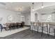 Stylish dining area with a large table, modern chairs, and bar seating at 1048 Claas Way, Locust Grove, GA 30248