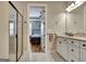 Bathroom featuring a glass shower and vanity with granite counters connecting to bedroom at 339 Cottonwood Cir, Peachtree City, GA 30269
