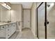 Bathroom featuring white cabinets, granite countertop, tiled shower, and natural lighting at 339 Cottonwood Cir, Peachtree City, GA 30269