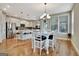 Dining Area with a white table and chairs, hardwood floors, and natural light at 339 Cottonwood Cir, Peachtree City, GA 30269