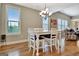 Dining area featuring a table with seating under a chandelier and large windows at 339 Cottonwood Cir, Peachtree City, GA 30269