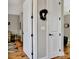 Bright hallway with hardwood floors and white doors, enhancing the home's appeal at 339 Cottonwood Cir, Peachtree City, GA 30269