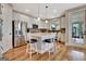 Kitchen featuring stainless steel appliances, a center island, and wood floors at 339 Cottonwood Cir, Peachtree City, GA 30269