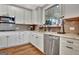 Kitchen featuring stainless steel appliances, granite counters and tile backsplash at 339 Cottonwood Cir, Peachtree City, GA 30269