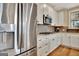 Stainless steel refrigerator and gas range with stainless steel microwave oven at 339 Cottonwood Cir, Peachtree City, GA 30269