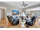 Spacious living room with ceiling fan, hardwood floors and an open concept to the kitchen area at 339 Cottonwood Cir, Peachtree City, GA 30269