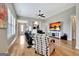 Bright and airy living room boasts hardwood floors, plush seating and seamless flow to other rooms at 339 Cottonwood Cir, Peachtree City, GA 30269