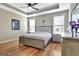 Elegant main bedroom with hardwood floors, a ceiling fan, recessed lights, and natural light at 339 Cottonwood Cir, Peachtree City, GA 30269