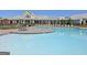 Resort-style community pool with ample seating and lounge chairs on a sunny day at 339 Cottonwood Cir, Peachtree City, GA 30269