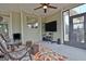 Bright sunroom with outdoor access, seating, and plenty of natural light at 339 Cottonwood Cir, Peachtree City, GA 30269