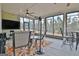 Inviting sunroom featuring comfortable seating, a ceiling fan, and ample natural light at 339 Cottonwood Cir, Peachtree City, GA 30269