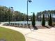 Well-maintained community tennis court surrounded by lush greenery and landscaping at 339 Cottonwood Cir, Peachtree City, GA 30269