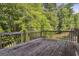 Spacious wooden backyard deck, perfect for enjoying the outdoors and entertaining guests at 260 Millbrook Village Dr, Tyrone, GA 30290