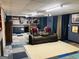 Basement area featuring comfortable seating and a home theatre, perfect for entertaining guests at 260 Millbrook Village Dr, Tyrone, GA 30290