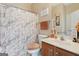 Clean bathroom featuring a shower with marble curtain, vanity and a toilet at 260 Millbrook Village Dr, Tyrone, GA 30290