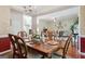 Open-concept dining area flowing into the living room at 260 Millbrook Village Dr, Tyrone, GA 30290
