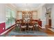 Elegant dining room with hardwood floors, a chandelier, and seating for six at 260 Millbrook Village Dr, Tyrone, GA 30290