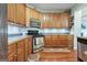 Kitchen featuring stainless steel appliances, ample cabinetry, and wood flooring at 260 Millbrook Village Dr, Tyrone, GA 30290