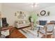 Inviting living room with a fireplace, hardwood floors, and neutral decor at 260 Millbrook Village Dr, Tyrone, GA 30290