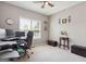 Bright office with a window, plush carpet, and ample space for a desk and seating at 260 Millbrook Village Dr, Tyrone, GA 30290