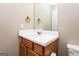 Bathroom featuring a wood vanity, mirror and neutral walls at 5797 Strathmoor Manor Cir, Lithonia, GA 30058