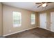 Bedroom featuring carpet, neutral walls, and two windows with blinds at 5797 Strathmoor Manor Cir, Lithonia, GA 30058