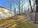 View of side yard, shed, and wooded area in backyard of home at 3750 Greenbrook Dr, Douglasville, GA 30135