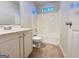 Bathroom featuring a single vanity, toilet, and shower/tub combo with tile floors at 3750 Greenbrook Dr, Douglasville, GA 30135