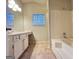 Bathroom featuring a shower-tub combo and a large mirror at 3750 Greenbrook Dr, Douglasville, GA 30135