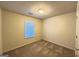 Neutral bedroom with carpeted floors and a window letting in natural light at 3750 Greenbrook Dr, Douglasville, GA 30135