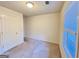 Neutral bedroom featuring carpet, a window, and a door to the hallway at 3750 Greenbrook Dr, Douglasville, GA 30135