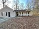 Charming single-story home with gray siding, black shutters and a covered front porch at 3750 Greenbrook Dr, Douglasville, GA 30135