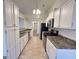 Galley kitchen featuring stainless steel appliances and white cabinetry at 3750 Greenbrook Dr, Douglasville, GA 30135