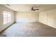 Spacious living room featuring neutral paint, carpeted floors, and ceiling fan at 3750 Greenbrook Dr, Douglasville, GA 30135