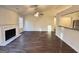 Bright and open living room featuring a fireplace, ceiling fan, and bar counter at 3750 Greenbrook Dr, Douglasville, GA 30135