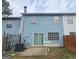 Backyard with a concrete patio and blue siding at 905 Pine Tree Trl, South Fulton, GA 30349