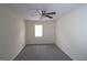 Bright bedroom featuring a ceiling fan and a window at 905 Pine Tree Trl, South Fulton, GA 30349
