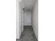 Inviting hallway with plush gray carpet and neutral paint at 905 Pine Tree Trl, South Fulton, GA 30349