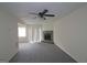 Spacious living room featuring a stone fireplace and sliding glass doors at 905 Pine Tree Trl, South Fulton, GA 30349