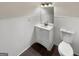 Clean bathroom with a modern vanity, mirror, three-bulb vanity lighting and white wainscoting at 1280 Pinyon Pl, Lawrenceville, GA 30043