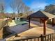 Backyard with a covered in ground pool area and an additional gazebo, perfect for entertaining at 1280 Pinyon Pl, Lawrenceville, GA 30043